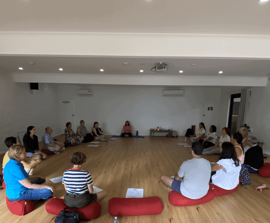 Group of women on a guided mindful nature walk through the Australian bushland at Yanada Retreat, St Albans; participants hiking along a forest trail during the Mystique Moksha Samatvam weekend.